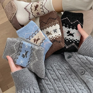 Fair Isle knit wool socks for women featuring cute cartoon dog and bow patterns