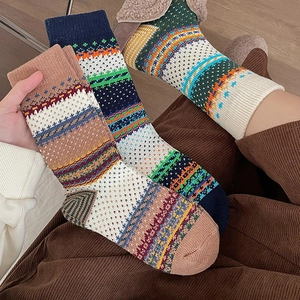 Fair Isle vintage patterned mid-calf socks with geometric knit textures in warm colors