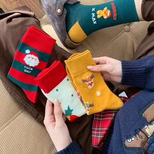 Cozy Christmas themed mid-calf cotton socks set with festive embroidery and stripes