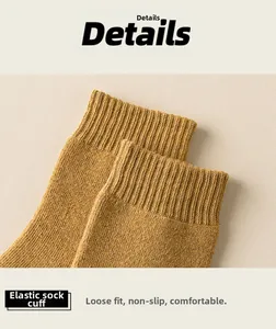 Detailed close-up of elastic ribbed cuff on mustard yellow thick cotton winter socks