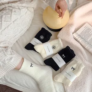 Thick thermal coral fleece socks for women featuring elegant bow and flower embroidery