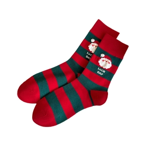 Christmas socks with red and green stripes featuring Santa Claus and Luck Day text