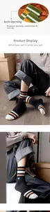Detail of elastic ribbed cuffs on striped cotton crew socks with snug fit and soft texture