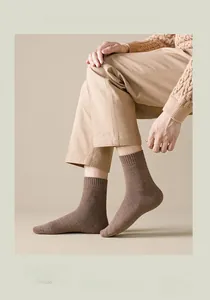 Detailed close-up of ribbed texture and premium combed cotton fabric on mid-calf socks