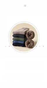 Close-up of thick winter socks showing the soft ribbed cuffs and warm terry lining texture