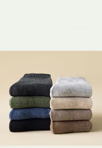 Detail view of colorful ribbed crew socks showing thick knit texture and elastic cuffs