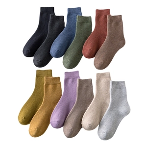 Set of 12 multi-color winter thermal crew socks with ribbed cuffs and thick knit texture