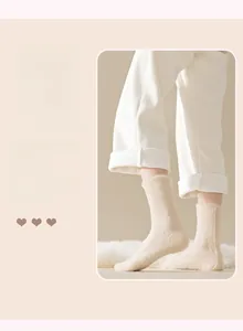 Detailed texture of thick cream mink cashmere thermal socks for winter warmth