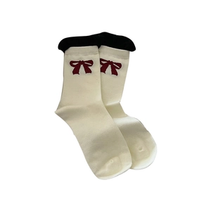 Beige cotton calf socks with dark red bow pattern and black trim details