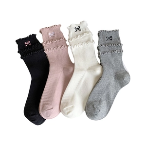 Women's cotton crew socks with embroidered bows and ruffled edges in multiple colors