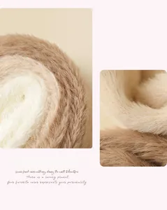 Detailed macro view of soft cream and tan plush knit fabric texture for thermal winter socks