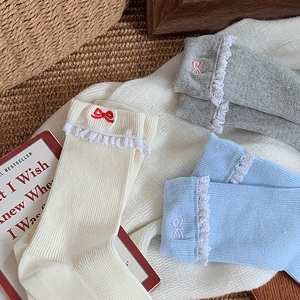 Women's cotton crew socks with white lace trim and bow embroidery in assorted soft colors