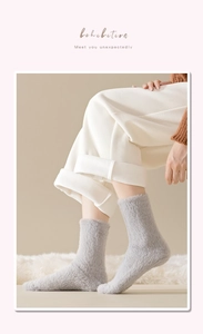 Close-up of thick grey mink cashmere socks with soft plush texture for winter warmth