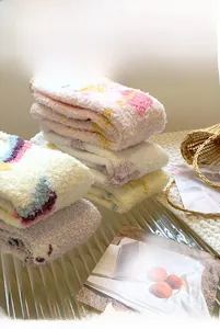 Thick coral fleece socks in pastel colors displayed on a stylish home tray for winter warmth