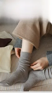 Close-up of ribbed texture and high-elastic cuff on thick winter thermal cotton socks
