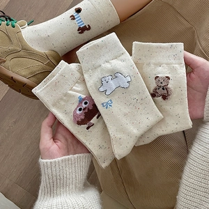 Cute cream mid-calf socks with colorful speckles and cartoon animal embroidery details