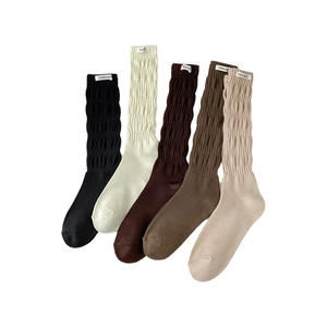 Five pairs of ribbed mid-calf socks in assorted neutral colors with woven brand labels