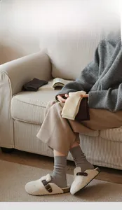 Detail of grey and beige thermal rib-knit cotton socks with comfortable thickened texture