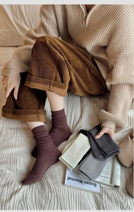 Close-up of thick ribbed cotton socks in vintage colors for autumn and winter wear
