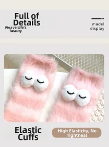 Detail of pink fuzzy socks with high elastic cuffs for comfortable non-slip fit
