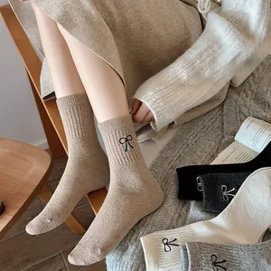 Thick wool socks for women with embroidered bow detail in various minimalist colors