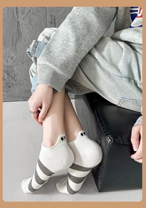 Detail view of cotton striped low-cut sock with cute eye embroidery on the heel