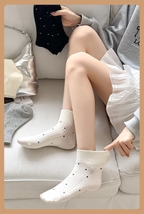 Close-up of cotton socks with classic polka dots and ribbed knit texture details