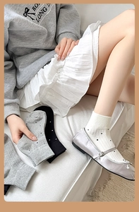 Detail shot of Japanese style polka dot cotton socks in various neutral colors