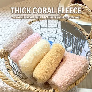 Thick coral fleece socks for women in pastel colors displayed in a rustic basket