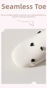 Detailed view of seamless toe construction on white polka dot cotton crew socks