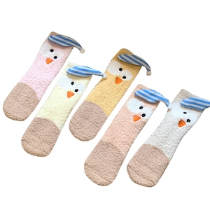 Cozy coral fleece winter socks for women featuring cute cartoon chick with sleep cap