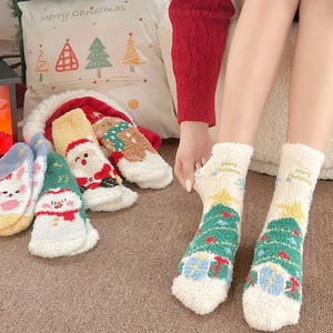 Cozy Christmas coral fleece socks set with thick cartoon santa and reindeer patterns