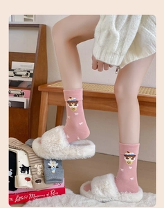 Detail of pink cotton mid-calf socks with cute cartoon bear embroidery and bow patterns