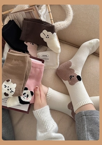 Detailed knit of cotton crew socks featuring cute cartoon animal embroidery and warm textures