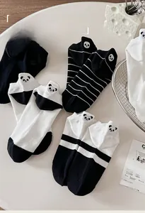 Close-up of panda embroidery details on classic black and white cotton ankle socks
