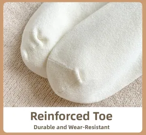 Close-up of reinforced toe design on white cotton socks for durability and comfort