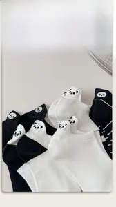 Detailed view of white cotton low-cut sock featuring a cute panda embroidery on the heel