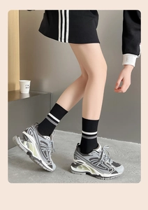 Detail view of futuristic chunky sneakers featuring a unique hollow shock-absorbing heel