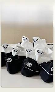 Detail view of cotton ankle socks featuring cute panda embroidery and black-white contrast