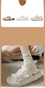 Detail of beige crew socks with colorful polka dots, pink bow embroidery, and ruffled cuffs