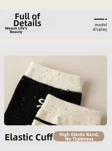 Detail of ribbed knit cotton sock cuff with colorful flecks and high elastic band