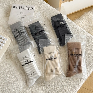 Set of 6 ribbed cotton crew socks with embroidered bows in neutral earthy tones