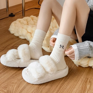Cozy cream plush double-strap slippers with matching embroidered bow ribbed cotton socks