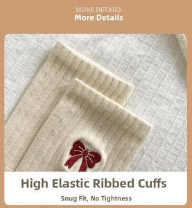 Macro detail of high-elasticity cuff and red bow embroidery on cream knit socks