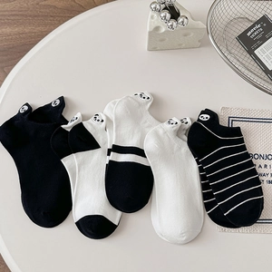 Set of black and white ankle socks featuring cute panda embroidery and striped patterns