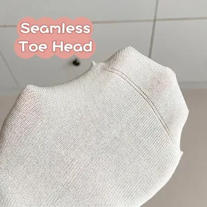 White cotton knit crew socks featuring seamless toe design and soft texture detail