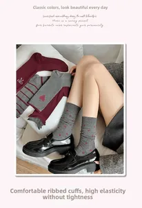 Detailed view of high-elastic mid-calf socks with heart embroidery and ribbed cuffs