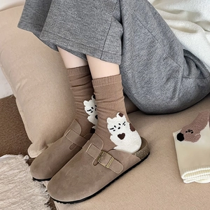 Brown suede mules paired with cute bear pattern cotton crew socks for autumn style
