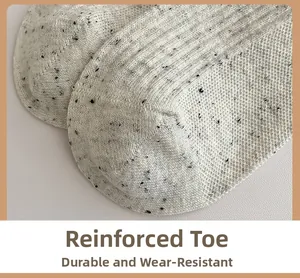 Close-up of reinforced toe on knit socks featuring vertical ribbing and flecked yarn