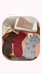 Retro bow-knot mid-calf socks set in burgundy and brown with ruffled lace trim